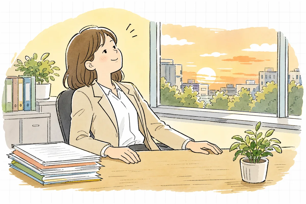 精算書を送り終えて、事務所の窓辺でひと息ついている賃貸管理担当者